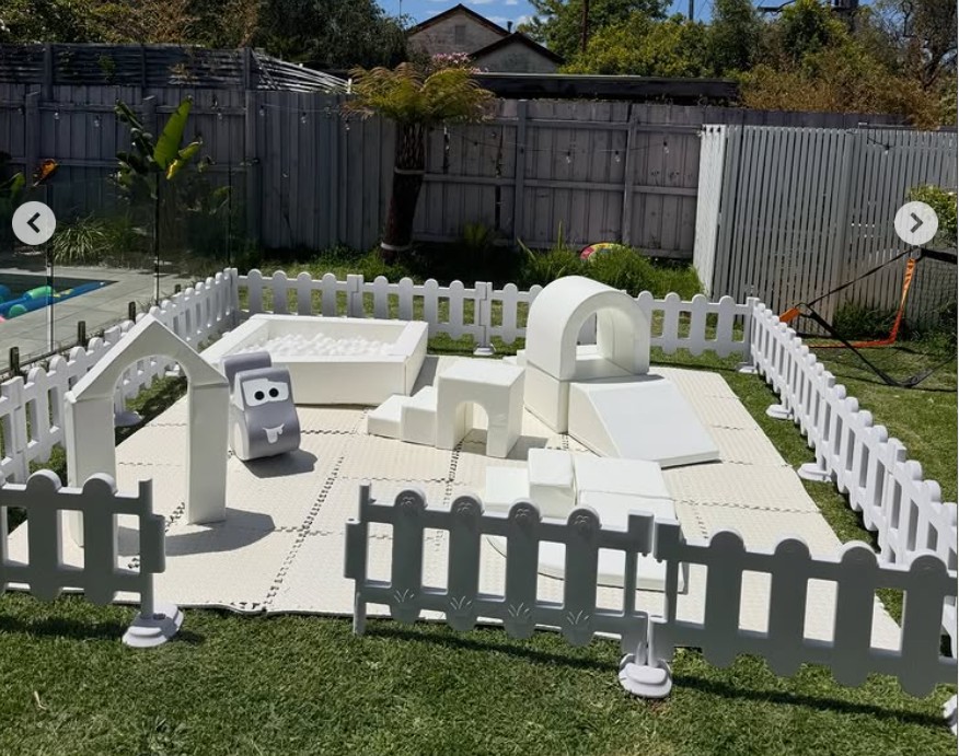 Bella Party Rental's full white soft play setup with picket fence in a Melbourne backyard